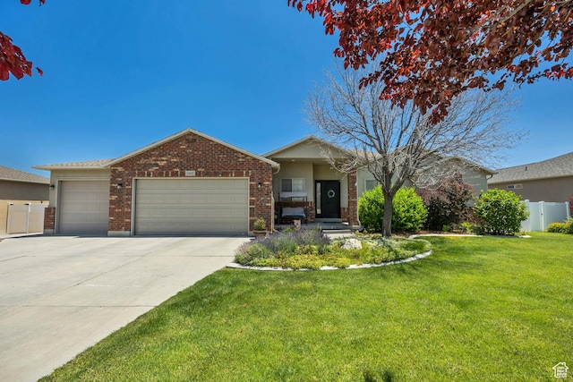 11645 S Keystone Dr, South Jordan, UT 84009 - ranch-style home featuring an attached garage, concrete driveway, and brick siding