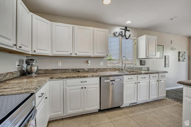 11645 S Keystone Dr, South Jordan, UT 84009 - kitchen featuring stainless steel appliances, white cabinetry, light tile patterned flooring, recessed lighting, and stone countertops