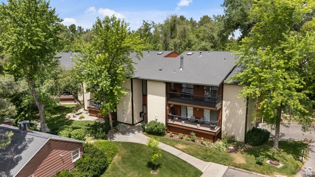 5544 S Springtree Ln E Unit H, Salt Lake City, UT 84107 - rear view of house featuring a balcony, stucco siding, and a shingled roof