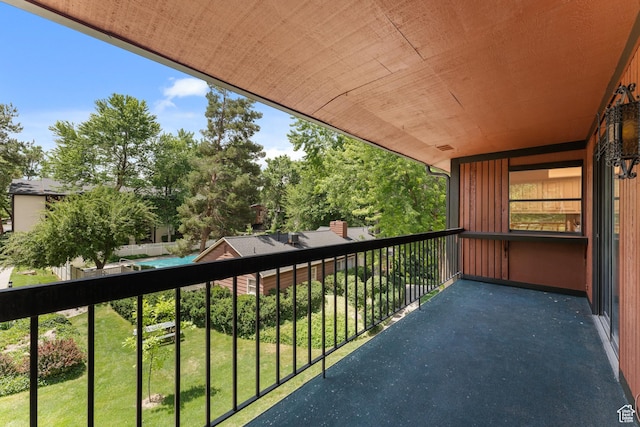 5544 S Springtree Ln E Unit H, Salt Lake City, UT 84107 - balcony featuring view of wooded area