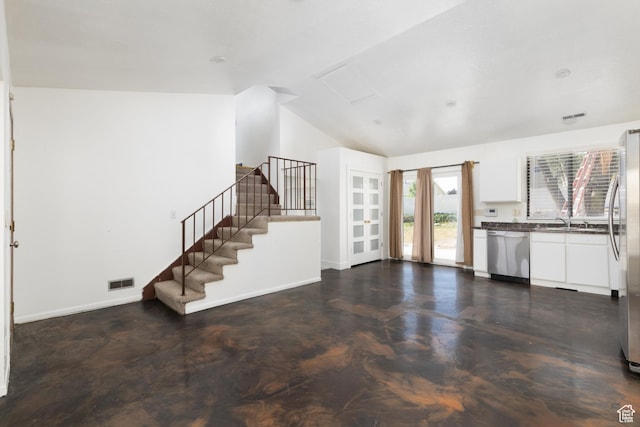 3453 W 5700 S, Taylorsville, UT 84129 - unfurnished living room with lofted ceiling and stairs