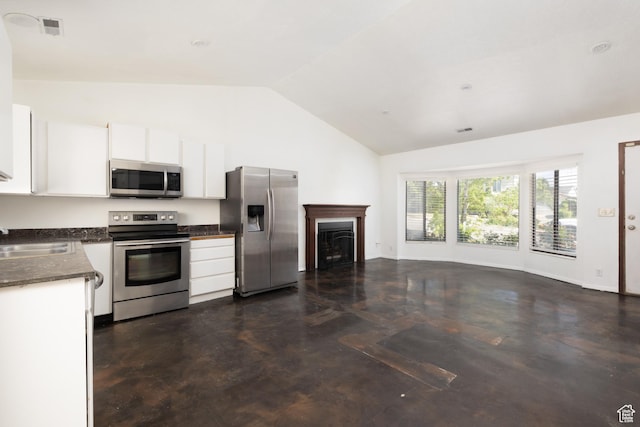 3453 W 5700 S, Taylorsville, UT 84129 - kitchen featuring stainless steel appliances, white cabinets, dark countertops, open floor plan, and a fireplace