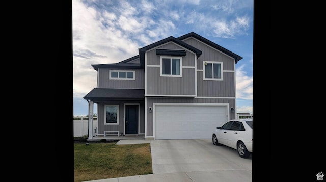 1991 Redtail Cir, Wellsville, UT 84339 - view of front facade with an attached garage, concrete driveway, and a front lawn
