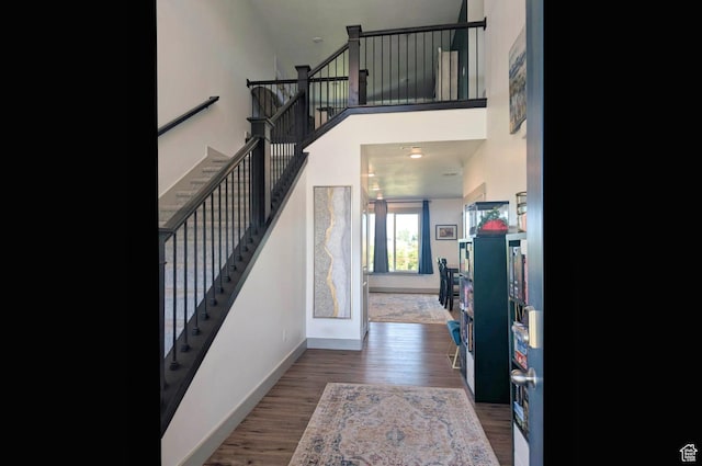1991 Redtail Cir, Wellsville, UT 84339 - foyer entrance with stairway, wood finished floors, and a high ceiling