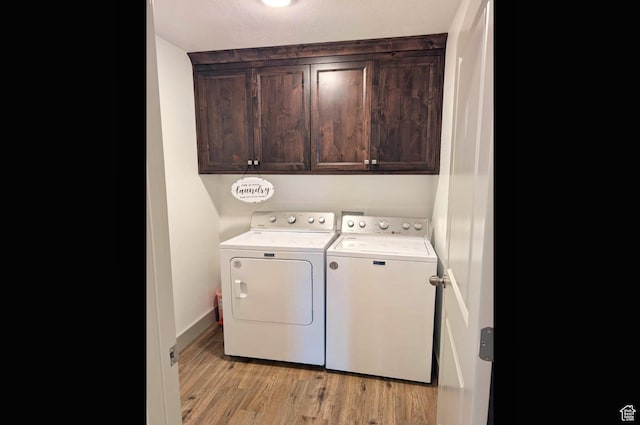 1991 Redtail Cir, Wellsville, UT 84339 - laundry room featuring independent washer and dryer, cabinet space, and light wood-style flooring