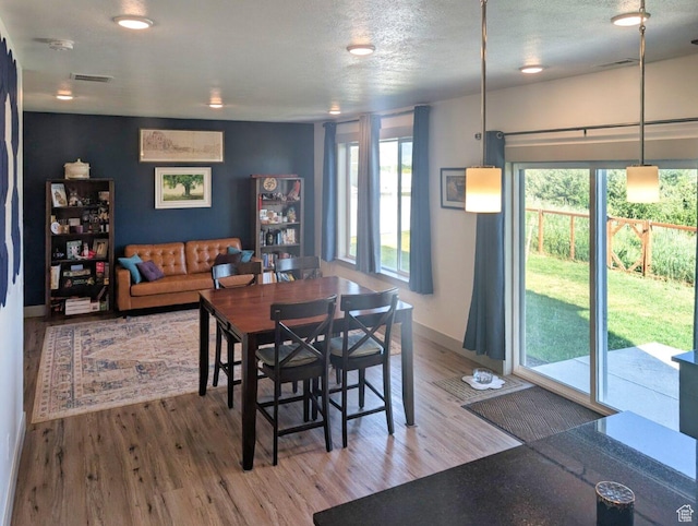 1991 Redtail Cir, Wellsville, UT 84339 - dining room featuring wood finished floors and a textured ceiling