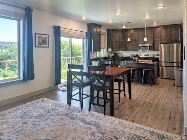 1991 Redtail Cir, Wellsville, UT 84339 - dining room with light wood-style floors, plenty of natural light, and recessed lighting