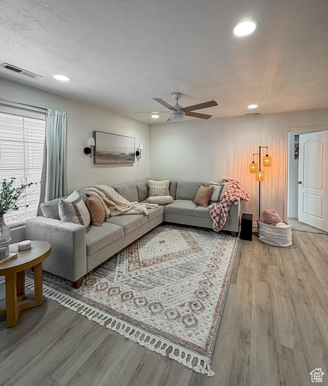 2930 E 450 N Unit F24, St George, UT 84790 - living area featuring light wood finished floors, a ceiling fan, and recessed lighting