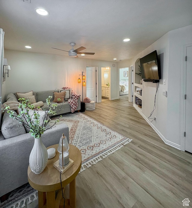 2930 E 450 N Unit F24, St George, UT 84790 - living area with wood finished floors, ceiling fan, and recessed lighting