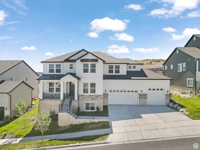 427 N High Ridge Rd Unit 1623, Saratoga Springs, UT 84045 - view of front of house with board and batten siding, driveway, stone siding, and an attached garage
