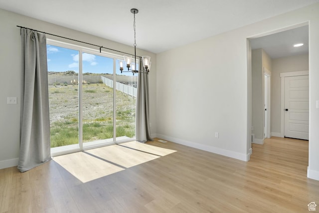 427 N High Ridge Rd Unit 1623, Saratoga Springs, UT 84045 - unfurnished dining area with a chandelier and wood finished floors