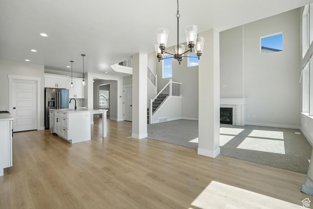 427 N High Ridge Rd Unit 1623, Saratoga Springs, UT 84045 - kitchen featuring open floor plan, recessed lighting, light countertops, white cabinets, and pendant lighting
