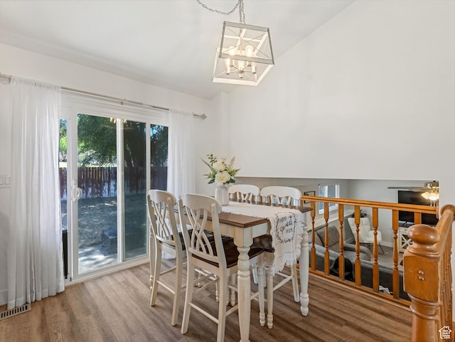 4736 S 2675 W, Roy, UT 84067 - dining space featuring wood finished floors, a chandelier, and lofted ceiling