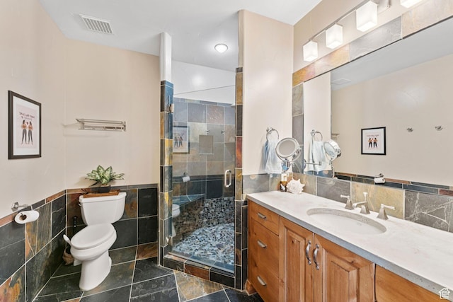 3231 E Lantern Hill Ct S, Cottonwood Heights, UT 84093 - full bathroom with tile walls, vanity, a stall shower, and a wainscoted wall