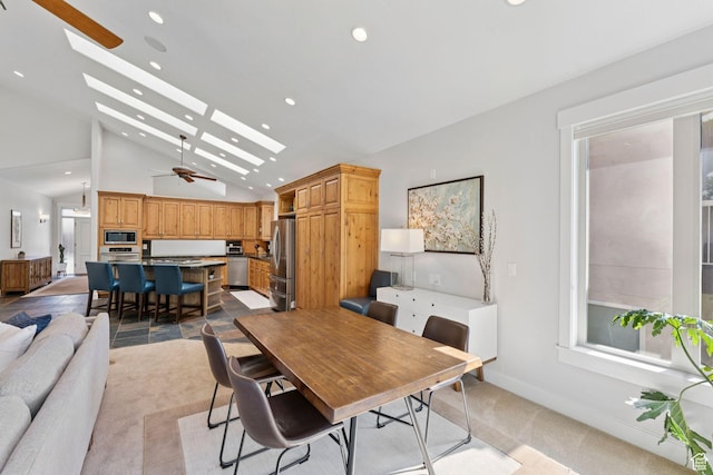 3231 E Lantern Hill Ct S, Cottonwood Heights, UT 84093 - dining space with light colored carpet, recessed lighting, a skylight, a ceiling fan, and high vaulted ceiling