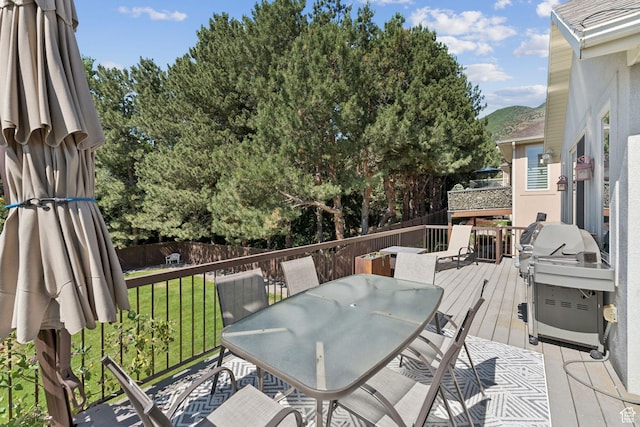 3231 E Lantern Hill Ct S, Cottonwood Heights, UT 84093 - wooden terrace with outdoor dining area, a grill, and a mountain view