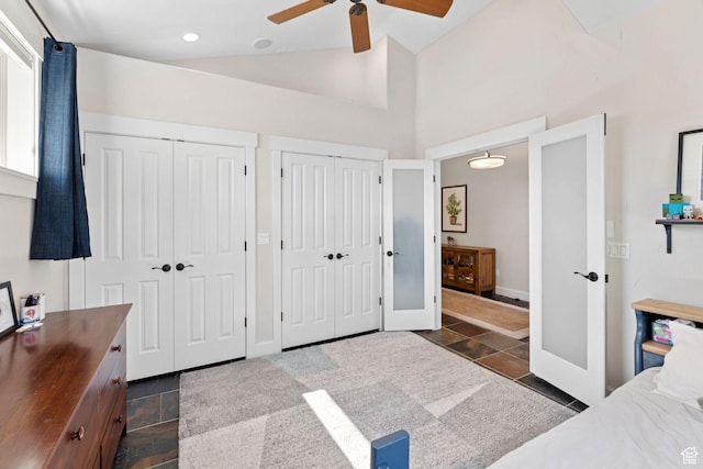 3231 E Lantern Hill Ct S, Cottonwood Heights, UT 84093 - bedroom with stone tile floors, two closets, vaulted ceiling, ceiling fan, and recessed lighting