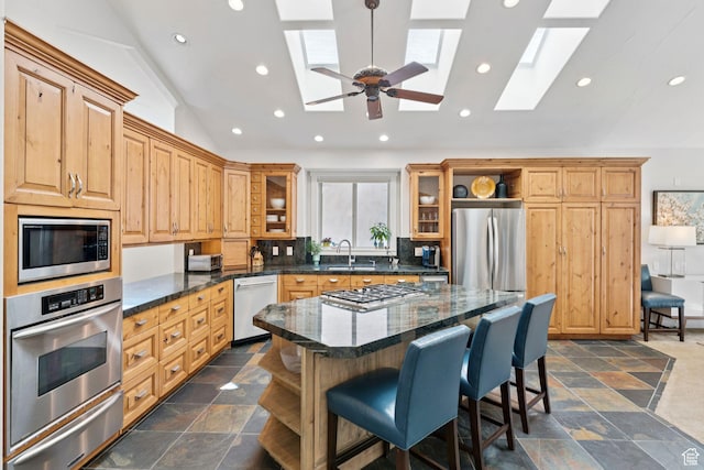 3231 E Lantern Hill Ct S, Cottonwood Heights, UT 84093 - kitchen with stainless steel appliances, vaulted ceiling, a skylight, a warming drawer, and open shelves