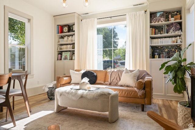 922 S 400 E, Salt Lake City, UT 84111 - living room featuring wood finished floors, plenty of natural light, and built in features