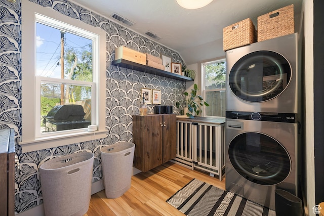 922 S 400 E, Salt Lake City, UT 84111 - laundry area featuring stacked washer / drying machine and light wood finished floors