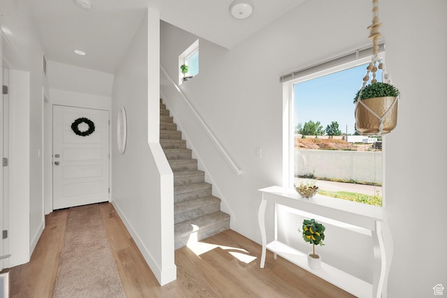 672 E 730 N Unit 25, Hyrum, UT 84319 - entrance foyer with wood finished floors and stairway