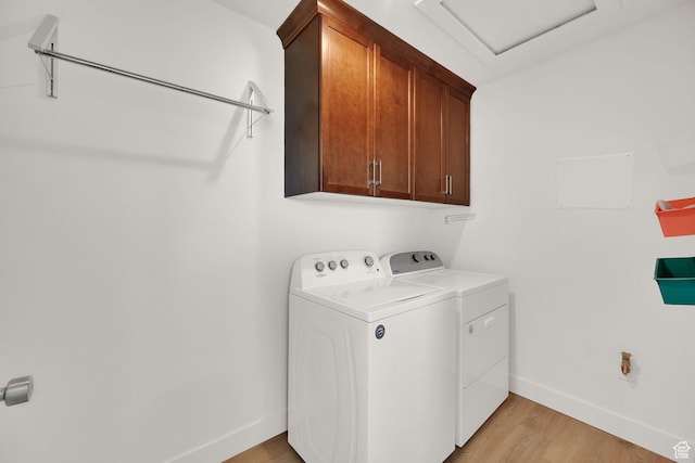 672 E 730 N Unit 25, Hyrum, UT 84319 - laundry area featuring cabinet space, washing machine and dryer, light wood-style floors, and attic access
