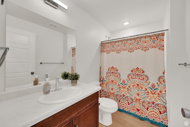 672 E 730 N Unit 25, Hyrum, UT 84319 - full bathroom with vanity, a shower with curtain, and wood finished floors