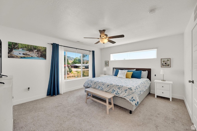 672 E 730 N Unit 25, Hyrum, UT 84319 - bedroom featuring a textured ceiling, light colored carpet, and a ceiling fan