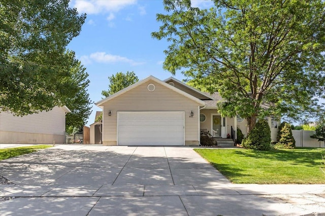 883 E 1775 N, North Ogden, UT 84414 - view of front of property with concrete driveway, an attached garage, and a storage shed