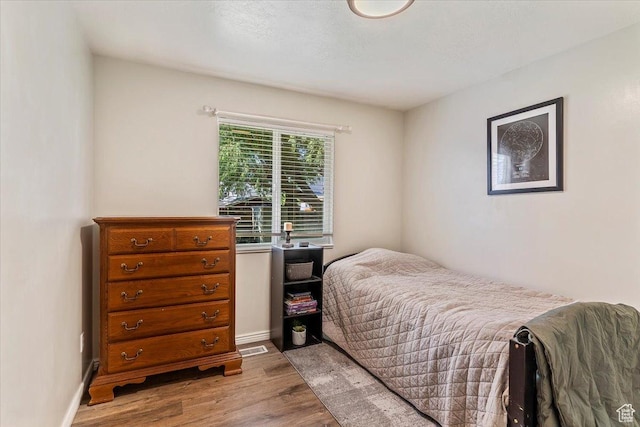 883 E 1775 N, North Ogden, UT 84414 - bedroom featuring wood finished floors and baseboards