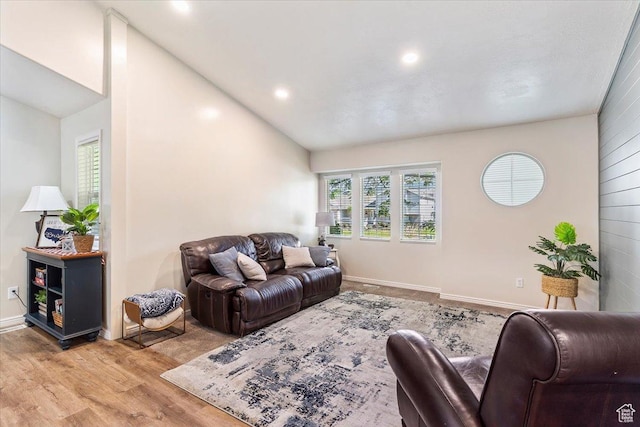 883 E 1775 N, North Ogden, UT 84414 - living room featuring plenty of natural light, lofted ceiling, wood finished floors, and recessed lighting