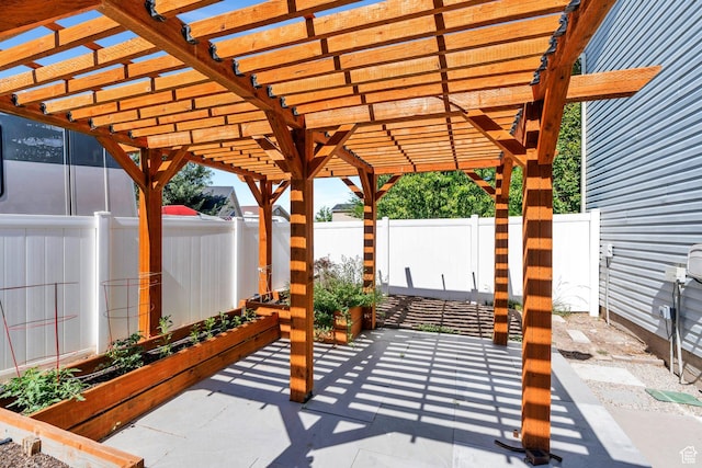 2541 S 1400 W, Woods Cross, UT 84087 - fenced backyard with a vegetable garden, a patio, and a pergola