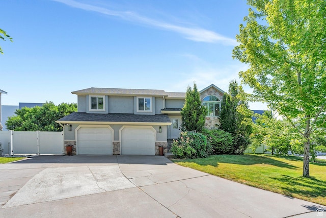 2541 S 1400 W, Woods Cross, UT 84087 - view of front of property featuring stone siding, stucco siding, an attached garage, and driveway