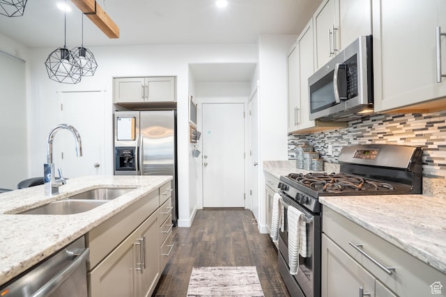 4759 W Vermillion Dr, South Jordan, UT 84009 - kitchen featuring stainless steel appliances, tasteful backsplash, dark wood-style flooring, light stone counters, and pendant lighting