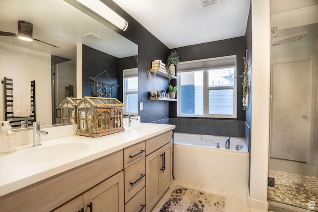 4759 W Vermillion Dr, South Jordan, UT 84009 - bathroom featuring a bath, double vanity, a stall shower, and healthy amount of natural light