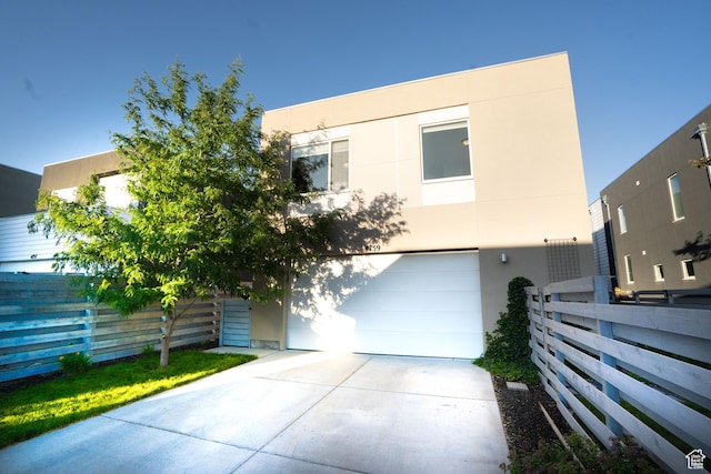 4759 W Vermillion Dr, South Jordan, UT 84009 - view of front of property featuring an attached garage, stucco siding, and concrete driveway