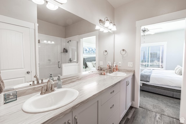 16 N 1000 E, Hyde Park, UT 84318 - bathroom featuring ensuite bathroom, double vanity, ceiling fan, wood finished floors, and a shower stall
