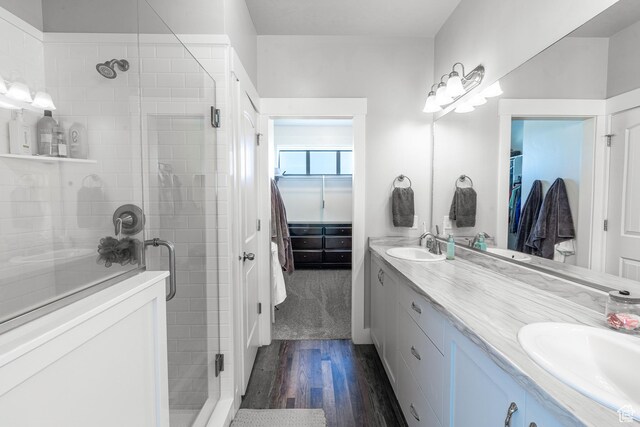 16 N 1000 E, Hyde Park, UT 84318 - full bath with double vanity, wood finished floors, a stall shower, and a walk in closet
