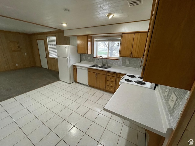 1721 N 750 W, Harrisville, UT 84404 - kitchen featuring white appliances, light countertops, decorative backsplash, brown cabinets, and wooden walls