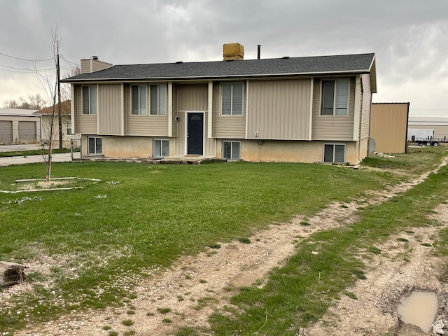 1721 N 750 W, Harrisville, UT 84404 - rear view of property featuring a chimney and a lawn