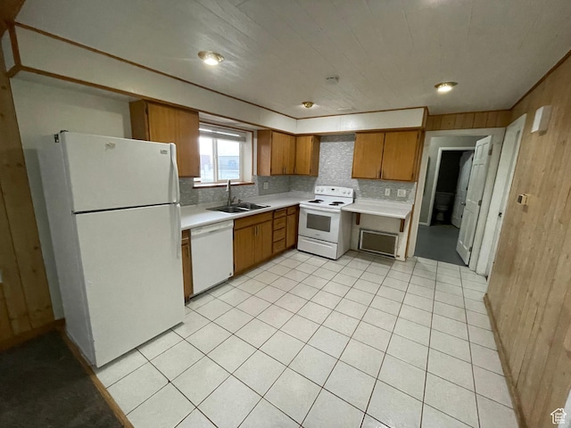 1721 N 750 W, Harrisville, UT 84404 - kitchen with white appliances, light countertops, wood walls, brown cabinets, and backsplash