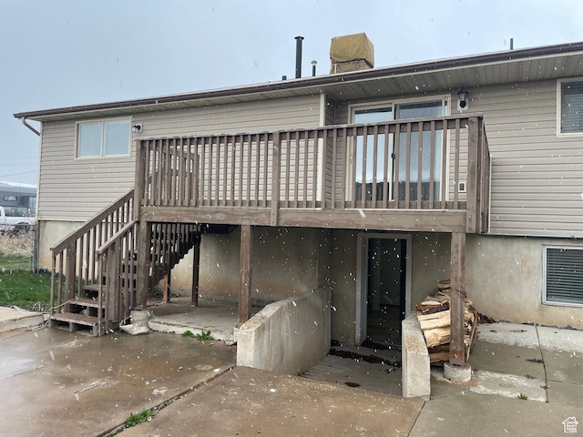 1721 N 750 W, Harrisville, UT 84404 - back of house featuring a wooden deck, a chimney, and stairway