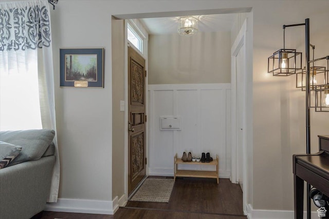 4879 S 1690 E, Holladay, UT 84117 - entryway with a decorative wall, dark wood-style floors, wainscoting, and a chandelier