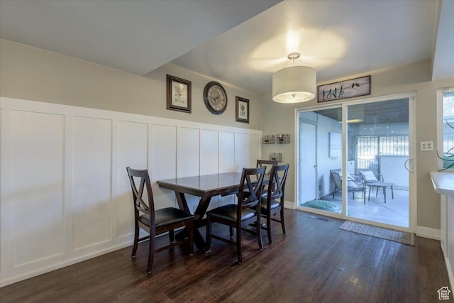 4879 S 1690 E, Holladay, UT 84117 - dining room with a decorative wall, dark wood-type flooring, and a wainscoted wall