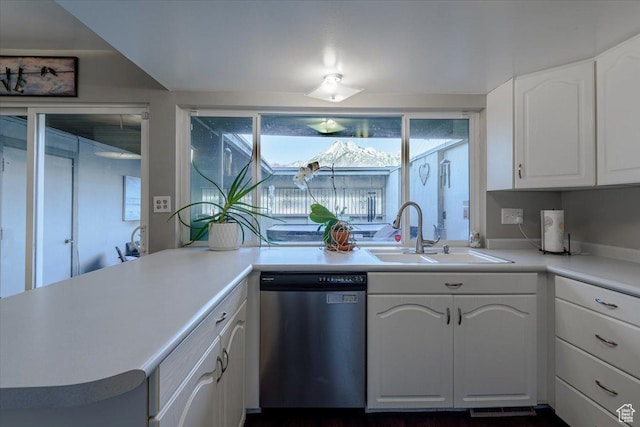 4879 S 1690 E, Holladay, UT 84117 - kitchen with stainless steel dishwasher, white cabinetry, and light countertops