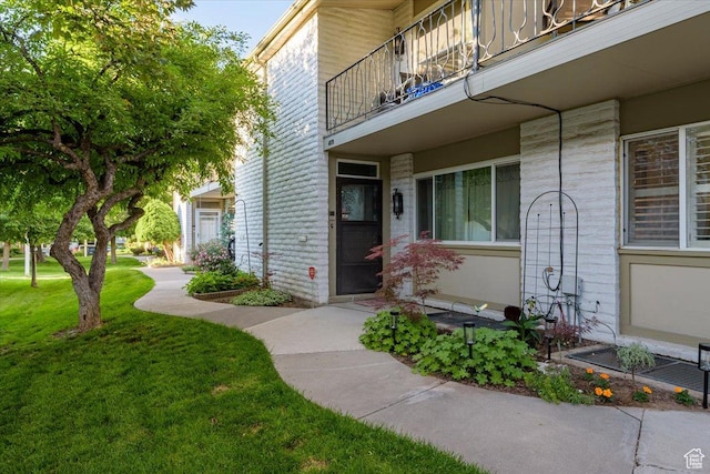 4879 S 1690 E, Holladay, UT 84117 - property entrance with a balcony and a lawn