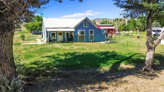 586 W 300 N, Fountain Green, UT 84632 - rear view of house with a porch, a metal roof, and a mountain view