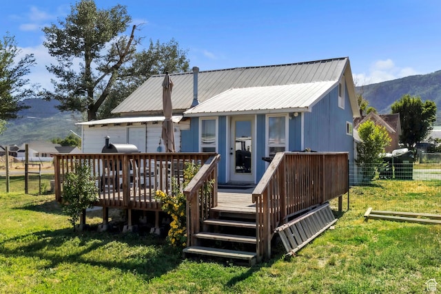 586 W 300 N, Fountain Green, UT 84632 - rear view of house with a deck with mountain view and a metal roof