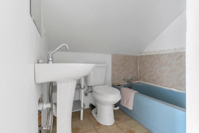 586 W 300 N, Fountain Green, UT 84632 - bathroom featuring a garden tub, lofted ceiling, and tile patterned flooring