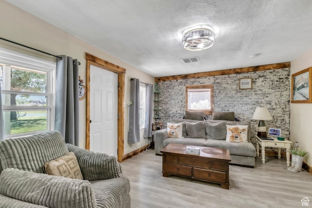 586 W 300 N, Fountain Green, UT 84632 - living area featuring a textured ceiling and light wood-style flooring